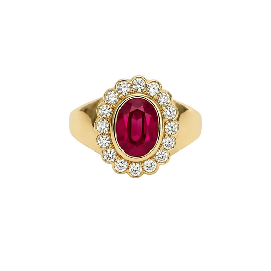 Gold ring with a ruby gemstone and diamond accents on a white background